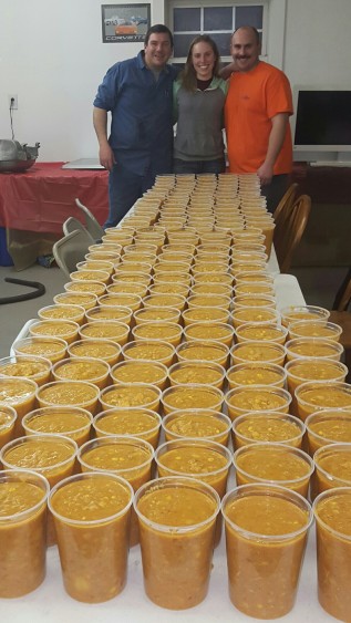 My coworkers and I posed with the final product, nearly 160 quarts of homemade brunswick stew!