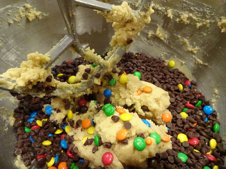 Mixing in the chocolate and M&Ms