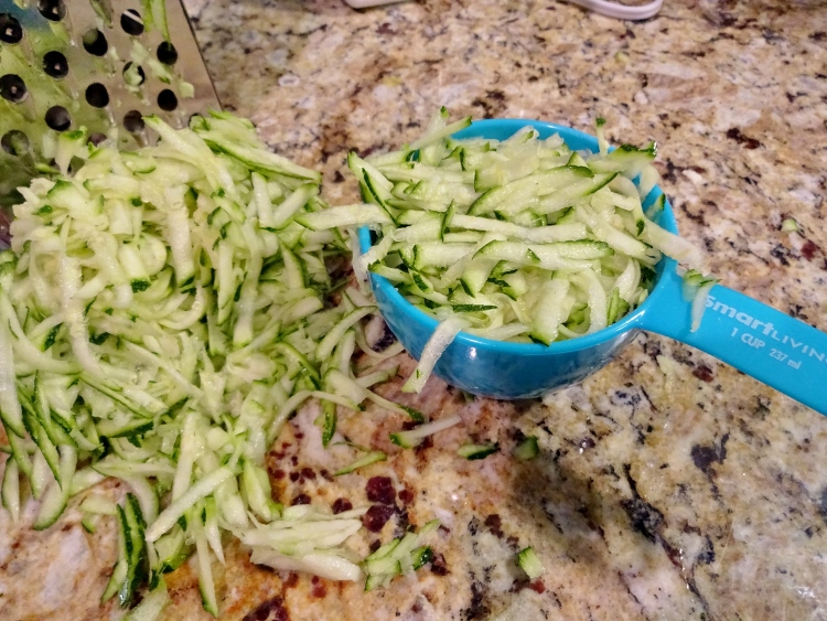 Grate the zucchini to a medium fineness, then measure out 2 cups